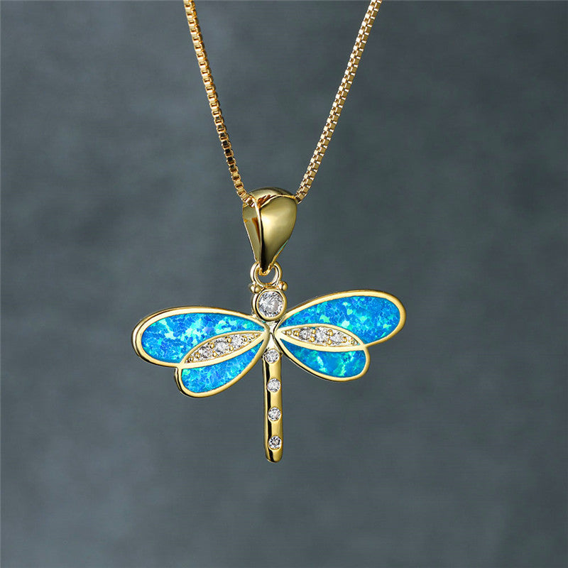 Maggie – Gold dragonfly necklace with opal