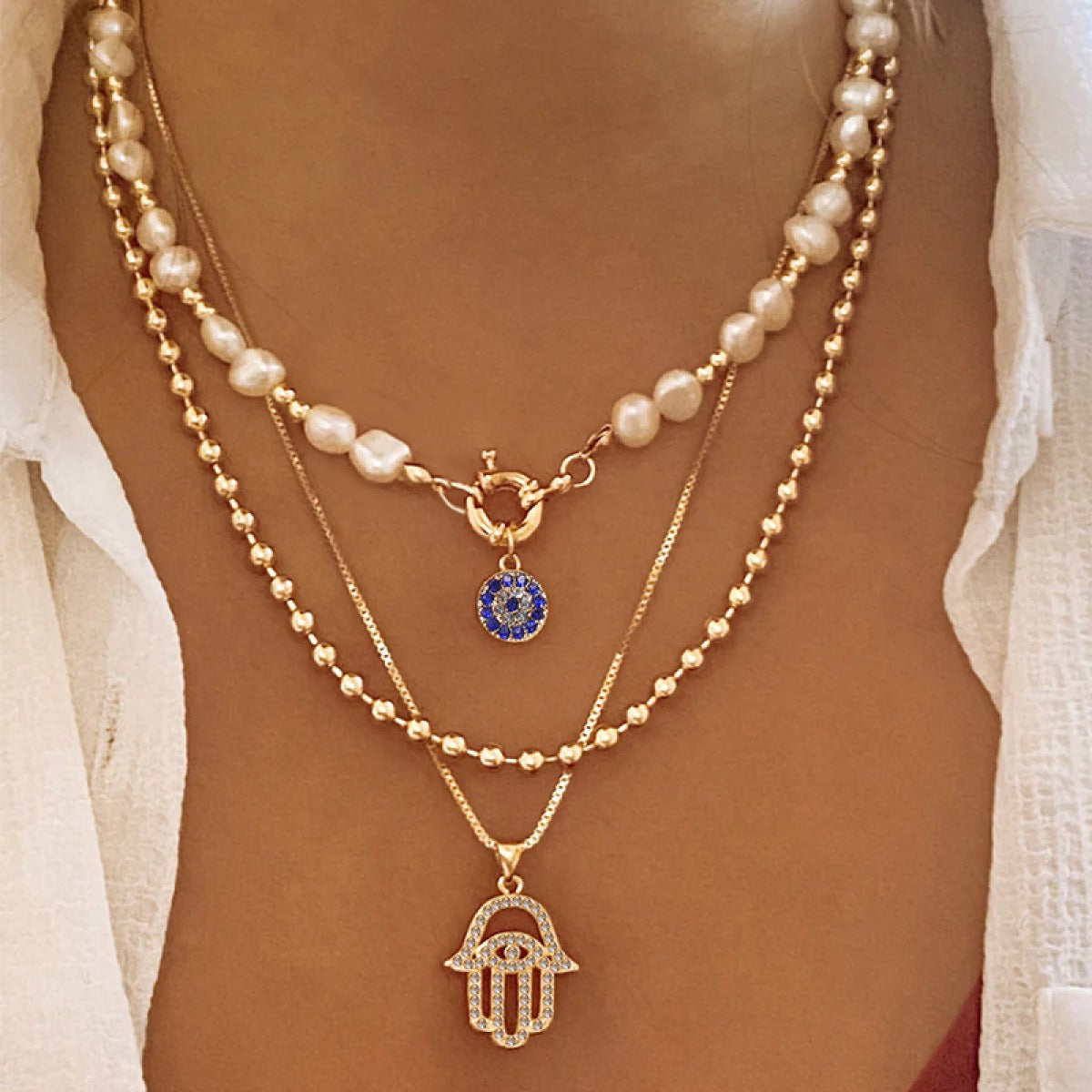 Jade – Multi-layer pearl necklace and Hamsa