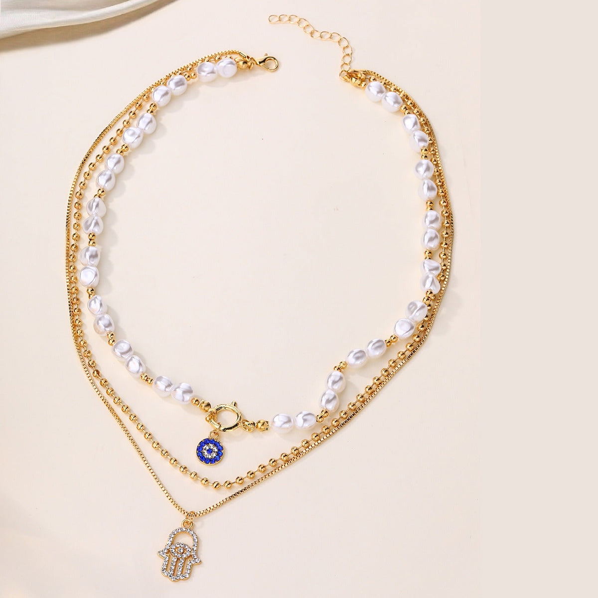 Jade – Multi-layer pearl necklace and Hamsa